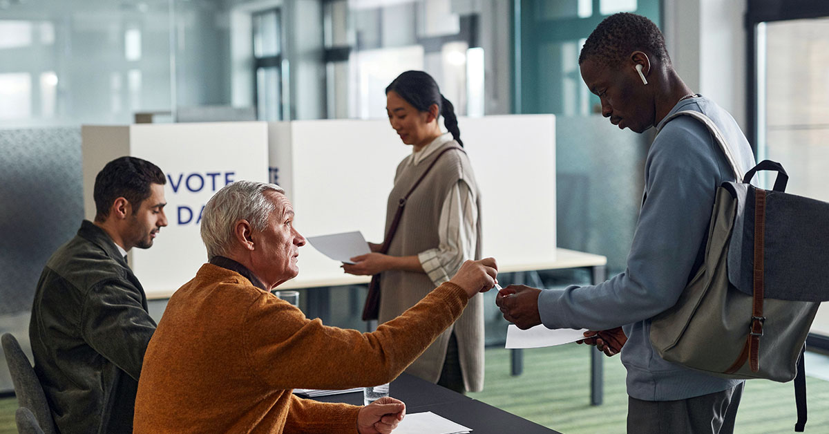 people waiting to vote in a line