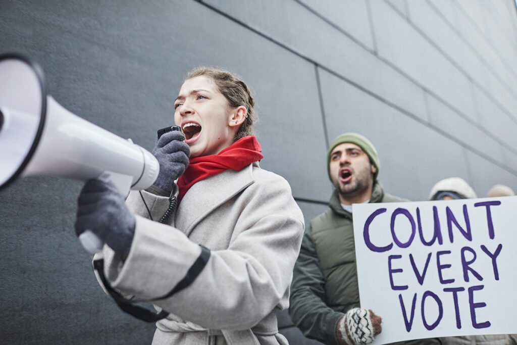 woman with a bullhorn protesting